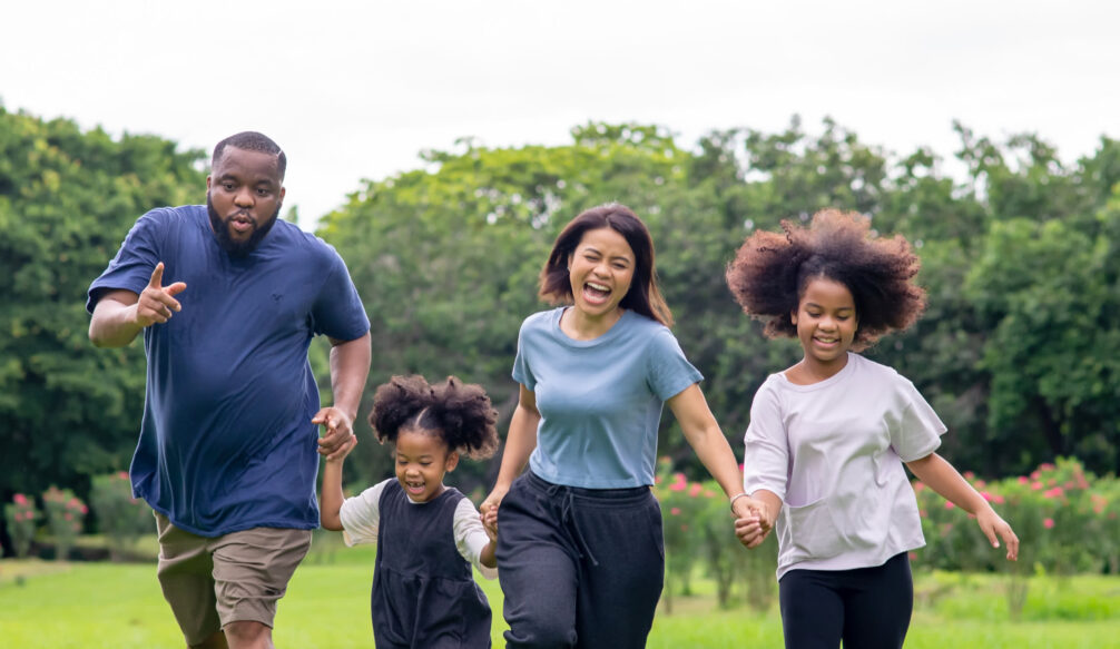 Family exercising outside together